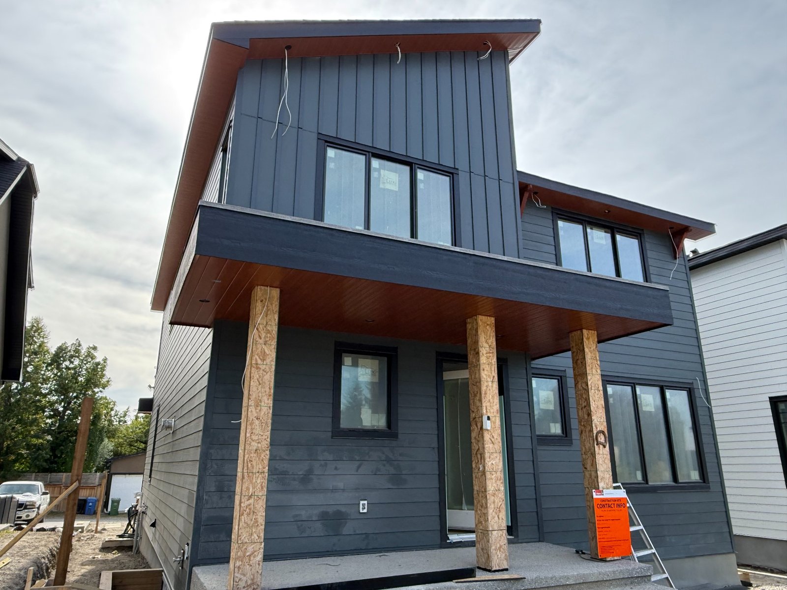 Front view of finished dark house exterior in Calgary