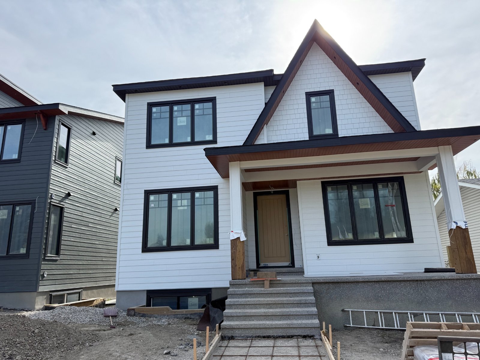 Completed white residential exterior in Calgary